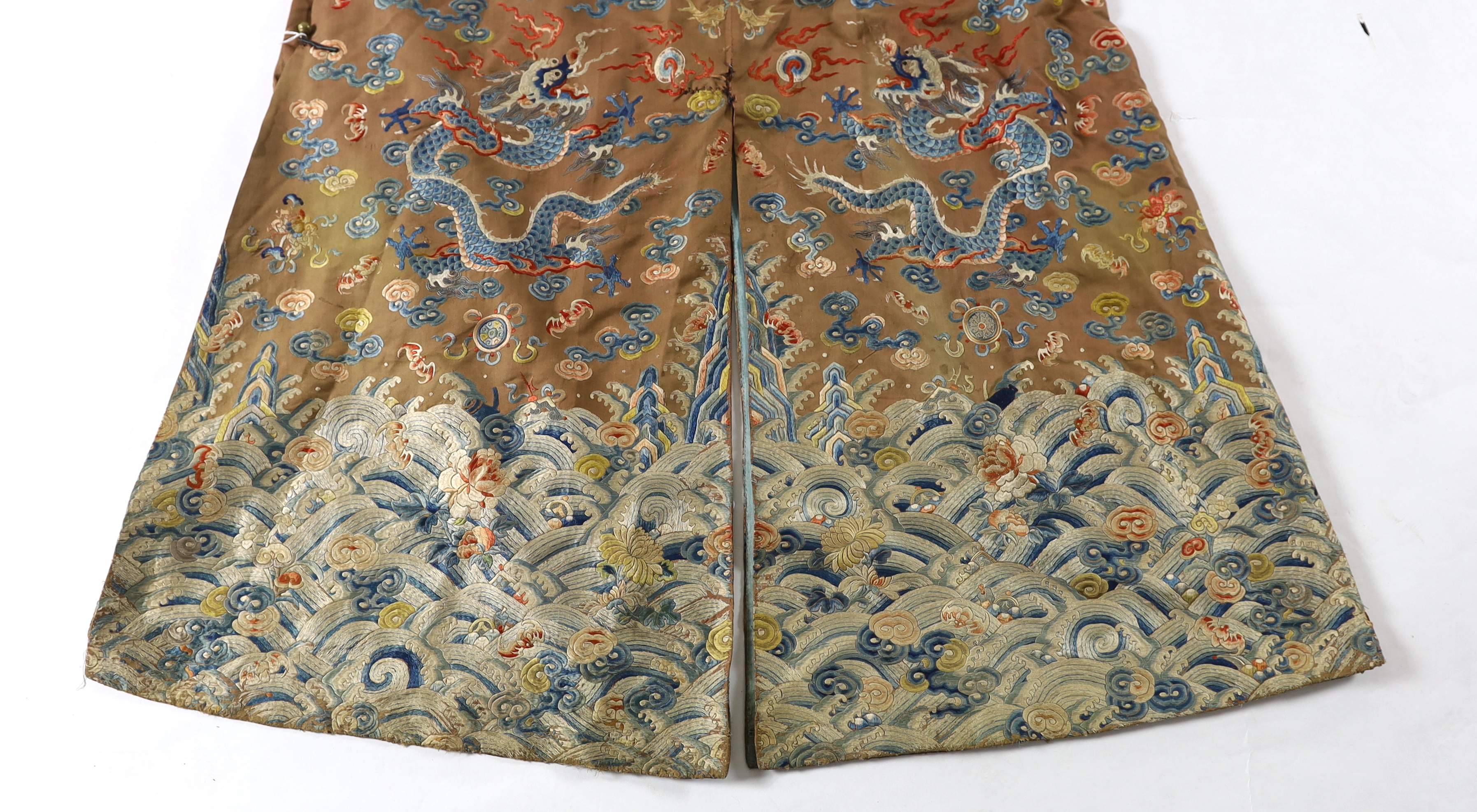 A Chinese chestnut-ground ‘nine dragon’ robe, jifu, 19th century, tears and losses